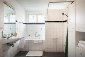 a bathroom with a sink and a shower at Hotel Nieuw Antiek in Helden +48 photos