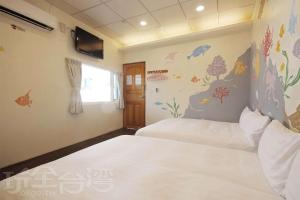 Giường trong phòng chung tại Lu Dao Homestay