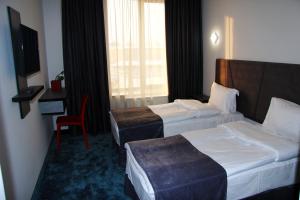 Voodi või voodid majutusasutuse Nice Hotel Yerevan toas