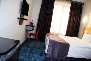 Voodi või voodid majutusasutuse Nice Hotel Yerevan toas