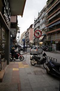 a group of motorcycles parked on a city street at Alexandros in Thessaloniki