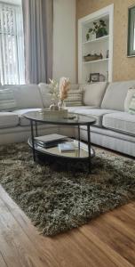 a living room with a couch and a coffee table at Churchview in Townhill
