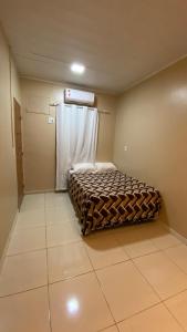 Cama ou camas em um quarto em Apartamento 1 aconchegante São Jorge