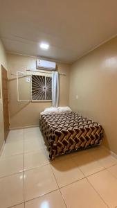 Cama ou camas em um quarto em Apartamento 1 aconchegante São Jorge