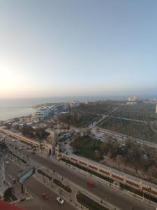 an aerial view of a city with a train at شقة ايفو ترى المنتزه بالكامل in Alexandria