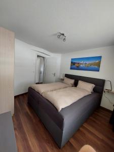 a bedroom with a large bed in a room at Alpin Relax in Saas-Almagell