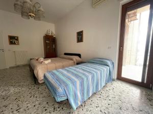 Säng eller sängar i ett rum på Il Cavalluccio Marino Room Sea View