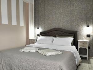 Postel nebo postele na pokoji v ubytování Domus Michaeli B&B Pompei