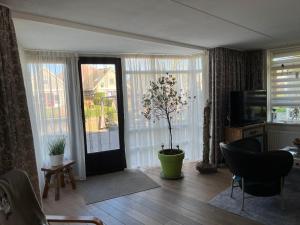 Posezení v ubytování Perle am Ijsselmeer mit eigenem Tretboot