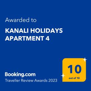 un signe jaune avec le texte attribué à la nomination pour les vacances au chenil dans l'établissement KANALI HOLIDAYS APARTMENT 4, à Kanali