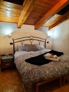 a woman laying on a bed in a bedroom at Mon grenier in Aosta