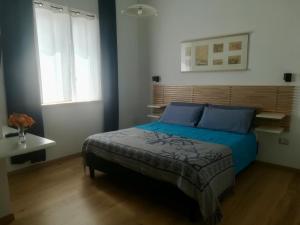 Postel nebo postele na pokoji v ubytování Domo Sul Porto