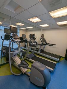 a gym with several tread machines in a room at SpringHill Suites by Marriott Athens West in Athens