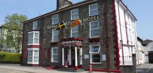 a black and white building on the corner of a street at Royal Sportsman Hotel in Porthmadog