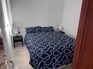 Posteľ alebo postele v izbe v ubytovaní Ático con vistas a patio cordobés