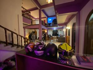 a group of helmets sitting on a counter in a room at Tashila Hostel in Gangtok