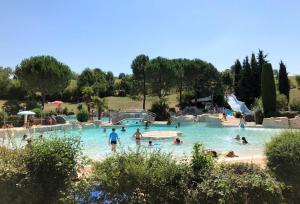 a group of people in a swimming pool at Maison Gaillacoise in Gaillac