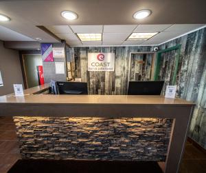 a view of a lobby with a stone counter top at Coast Fort St John Hotel in Fort Saint John