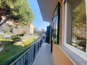 a balcony with a view of a street at COMFORTABLE SEA HOLIDAYS AND WALKS in Moneglia