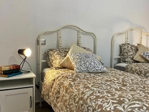 a bedroom with a bed with pillows on it at COMFORTABLE SEA HOLIDAYS AND WALKS in Moneglia