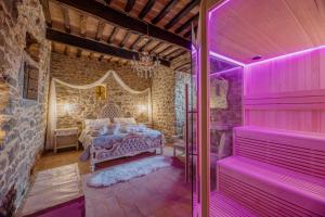 A bed or beds in a room at San Lazzo Luxury Room - ROOM & PERSONAL SPA