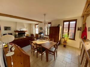 a kitchen and dining room with a table and chairs at Maison 5 chambres à Lamotte, entre canal et centre équestre in Lamotte-Beuvron +34 photos