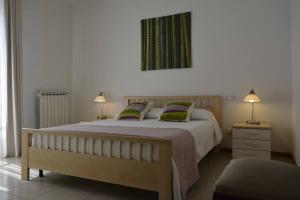 Ένα ή περισσότερα κρεβάτια σε δωμάτιο στο Appartamento Verdi, a 100 metri dal mare.