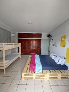 a bedroom with a bunk bed and a bunk bed frame at Guará Hostel in São Luís