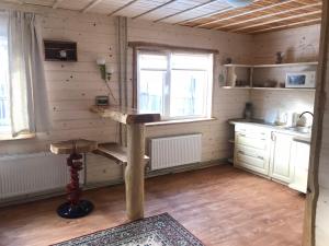 a kitchen with a table in the corner of a room at Kostel House in Mykulychyn