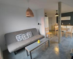 a living room with a couch and a table at Słoneczny Zakątek Sominy in Sominy +29 photos