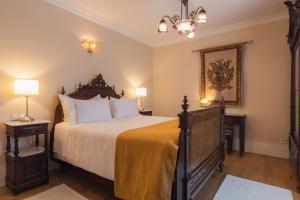 Uma cama ou camas num quarto em Quinta do Outeiro