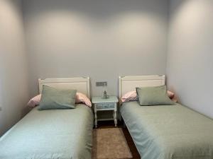 A bed or beds in a room at Casa La Rosada