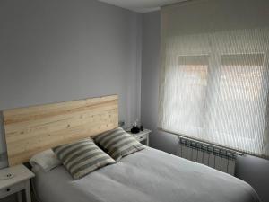 A bed or beds in a room at Casa La Rosada