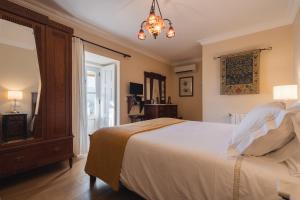 Uma cama ou camas num quarto em Quinta do Outeiro
