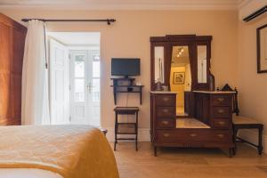 Uma cama ou camas num quarto em Quinta do Outeiro