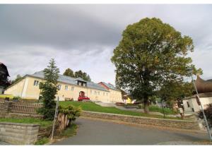 a street in a residential neighborhood with a house at Apartman 22, Rezidence & Wellness Javor in Železná Ruda