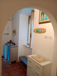 an archway in a bathroom with a sink and a desk at MOLO 37 in La Spezia