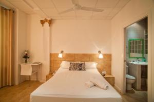Posteľ alebo postele v izbe v ubytovaní Hostal Martinval