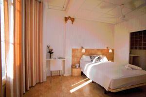 Posteľ alebo postele v izbe v ubytovaní Hostal Martinval