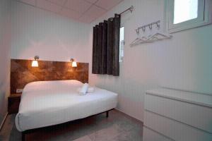 Posteľ alebo postele v izbe v ubytovaní Hostal Martinval