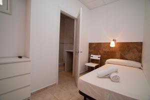 Posteľ alebo postele v izbe v ubytovaní Hostal Martinval