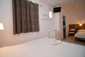 Posteľ alebo postele v izbe v ubytovaní Hostal Martinval
