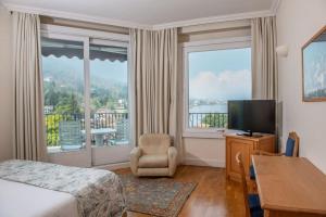 Postel nebo postele na pokoji v ubytování Hotel Royal + 37 fotografií