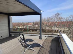 a metal sculpture on the roof of a building at Hotel Szatmári & Étterem Jászberény in Jászberény