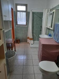 a bathroom with a toilet and a sink at Villa mendola in Cianciana