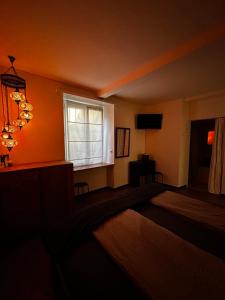 Postel nebo postele na pokoji v ubytování Charming Room in the heart of Locarno