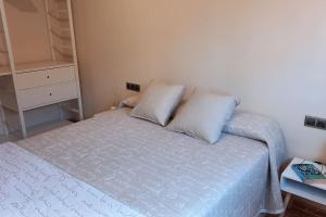 A bed or beds in a room at Atico duplex en Malgrat de Mar