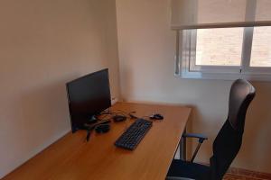 A television and/or entertainment centre at Atico duplex en Malgrat de Mar