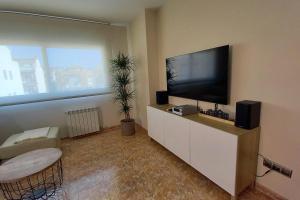 A television and/or entertainment centre at Atico duplex en Malgrat de Mar