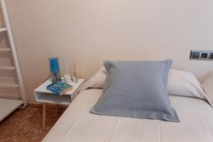 A bed or beds in a room at Atico duplex en Malgrat de Mar